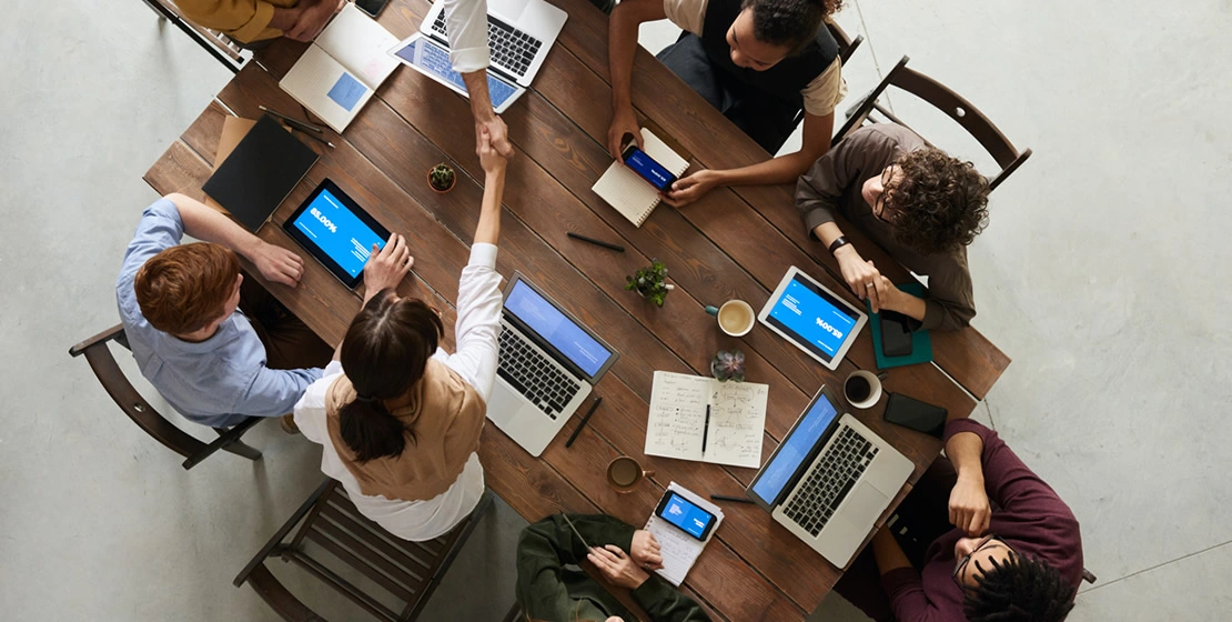 Group of people discussing at table